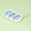 A white silicone popsicle mold tray with a clear lid and three silicone molds for making popsicles.