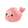 A pink musical whale bath toy with light-up water spray and a flipper.