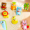 A collection of colorful animal plush toys, including a bear, carrot, frog, lion, and rabbit, displayed on a woven mat.