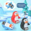 A set of animal racing car climbing stairs toys featuring a red penguin, a black penguin, and a blue car.