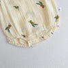 A cream-colored baby cotton sleeveless jumpsuit bodysuit set with small olive leaf embroidery.