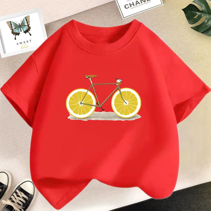 A bright red kids t-shirt featuring a graphic print of a bicycle with sliced oranges on the front.