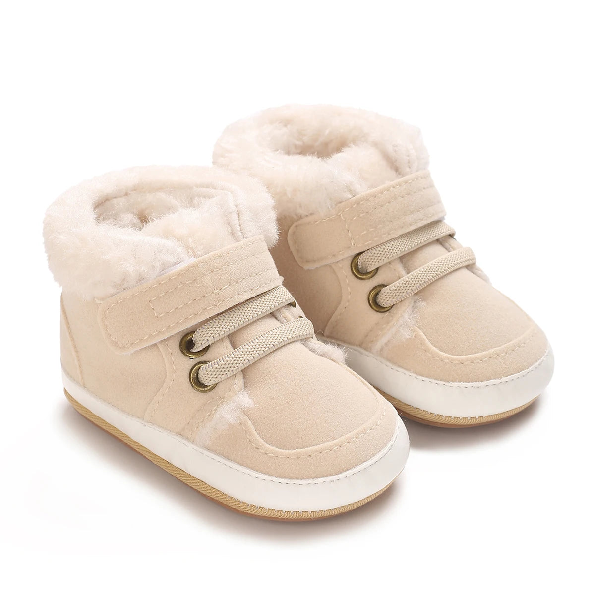 A pair of beige faux fur baby winter snow boots for toddlers.
