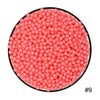 Runde Anordnung rosa Wasserperlen für sensorisches Spielen.