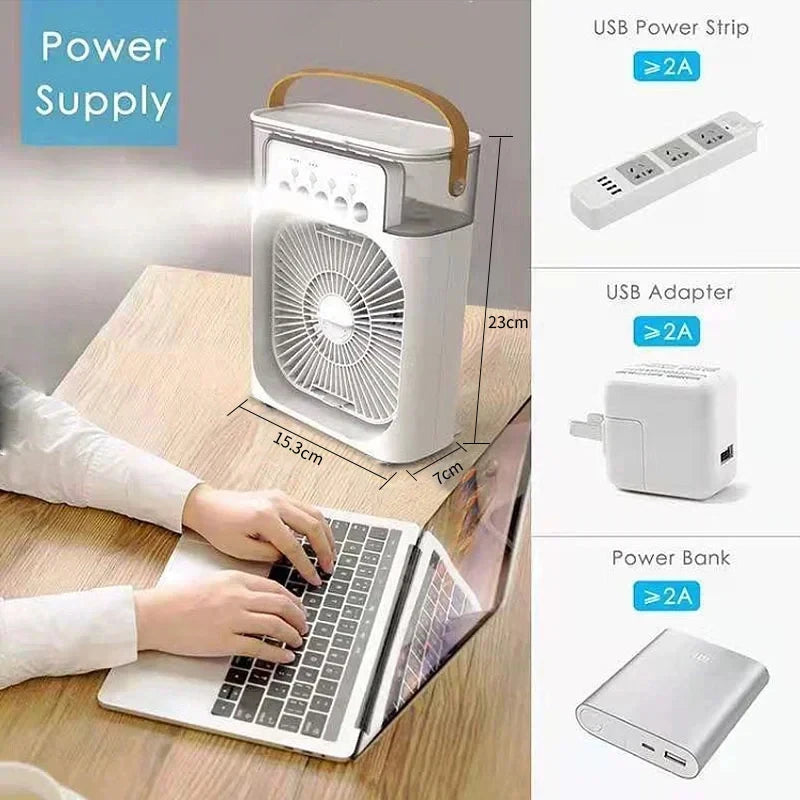 A white personal air cooler fan and humidifier device is shown next to a laptop, demonstrating its use as a USB power supply.