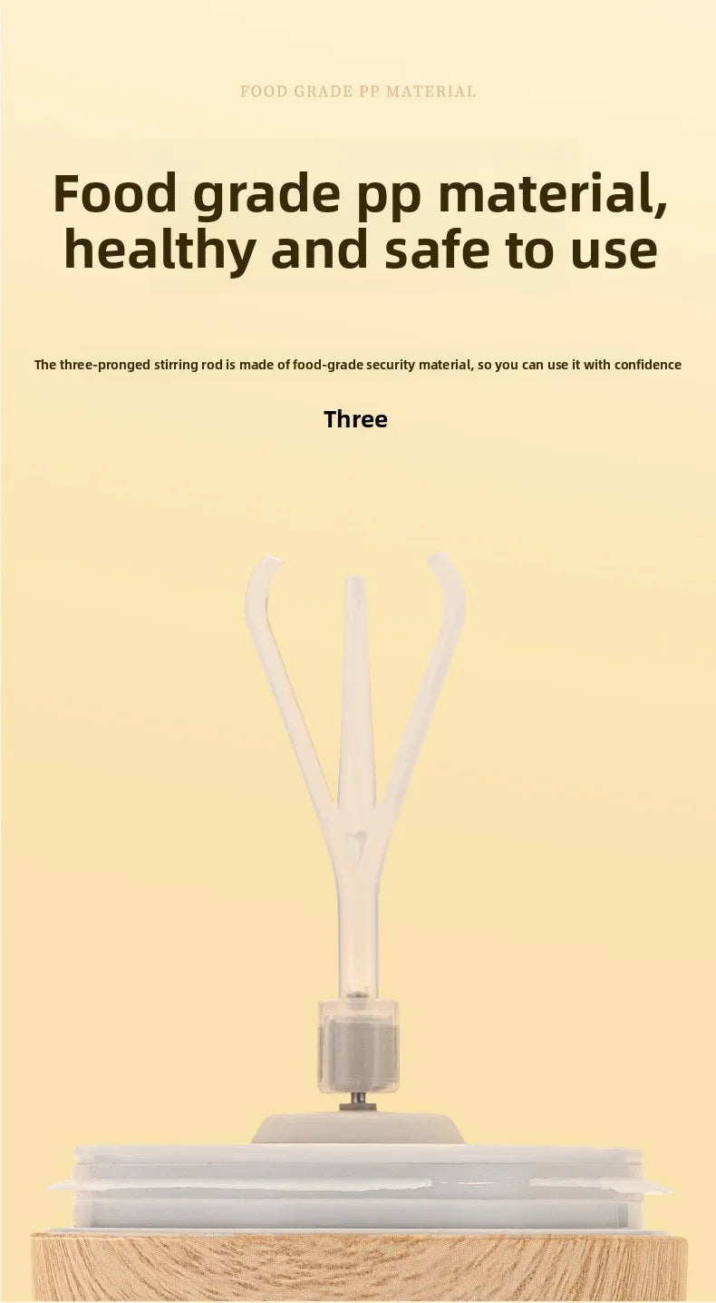 A white self-stirring mug with a wooden base and handle is shown on a light background.