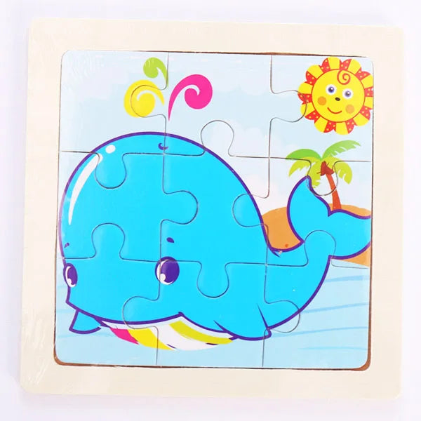 A blue whale puzzle featuring a smiling sun and a palm tree on a light background.