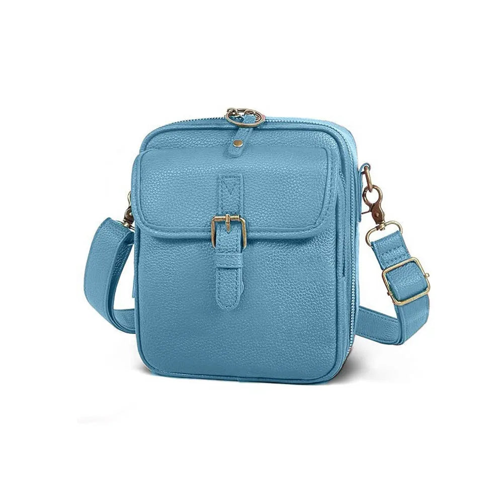 A light blue vegan leather messenger bag with a gold-toned clasp and adjustable strap.