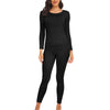 A woman wearing a black long-sleeved thermal top and matching full-length leggings.