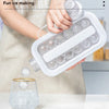 A hand is holding a white ice cube tray filled with clear ice cubes, demonstrating the making of ice.