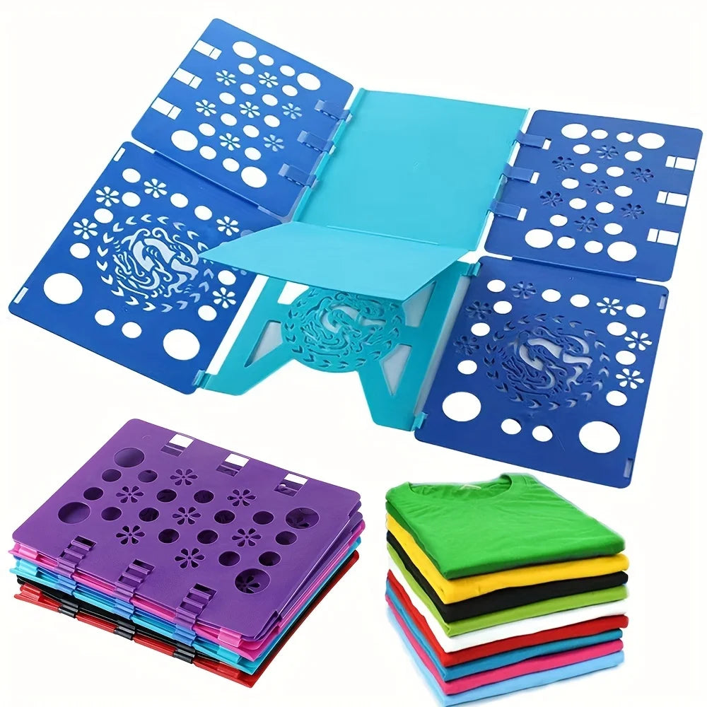 A blue clothes folding board with multiple folding panels and a stack of purple, green, yellow, and blue laundry folders.