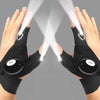 Pair of black LED fingerless gloves with built-in flashlights illuminating the palms