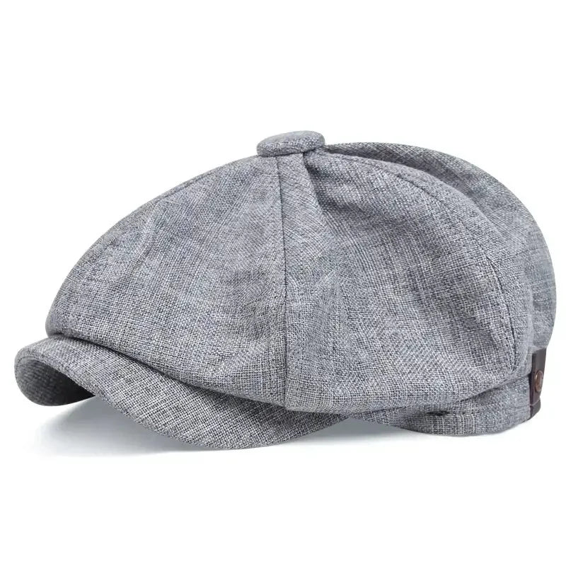 A grey vintage retro newsboy cap with a folded brim shown from above.