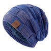 A navy blue knit beanie with a multicolored patterned yarn detail, shown from above.
