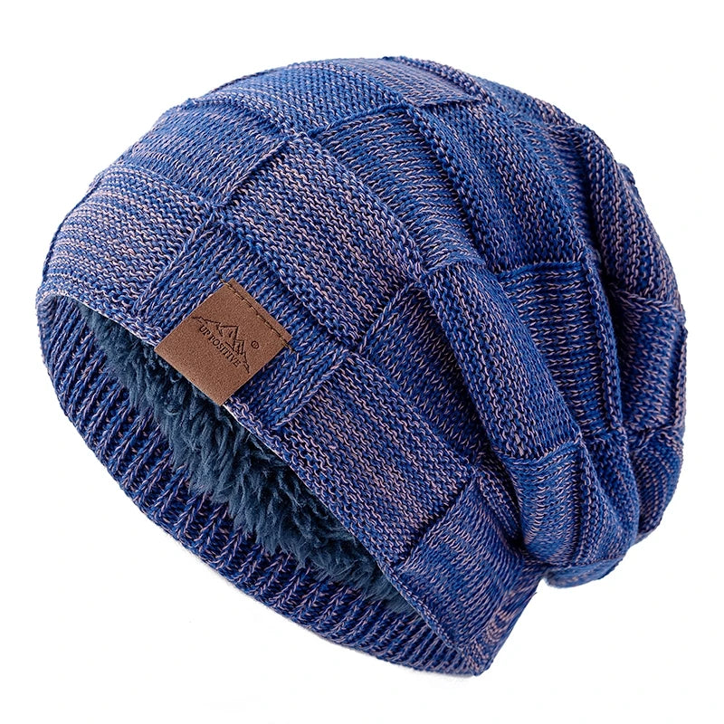 A navy blue knit beanie with a multicolored patterned yarn detail, shown from above.