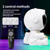 A white astronaut night light is shown with control methods including a button switch and a remote control.