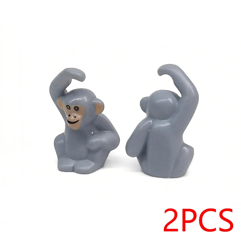 Two gray zoo animal figures, a monkey and a gorilla, are shown against a white background.