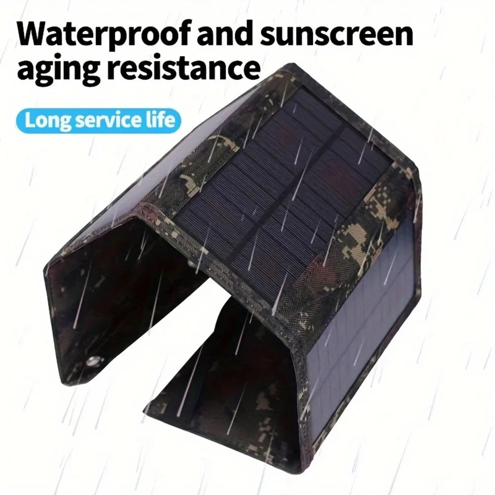 A dark, foldable solar panel charger with a camouflage pattern is shown.