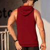 A muscular man wearing a maroon performance hooded tank top and black shorts, viewed from the back.