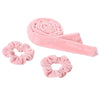 Pink heatless curling rod headband with a rolled design and a flower-like scrunchie