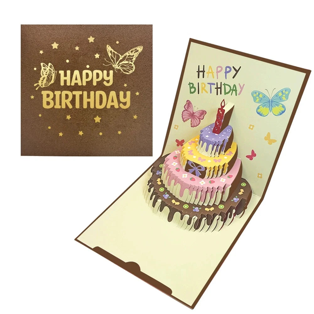 A pop-up birthday card featuring a layered cake design with pink frosting and green decorations.