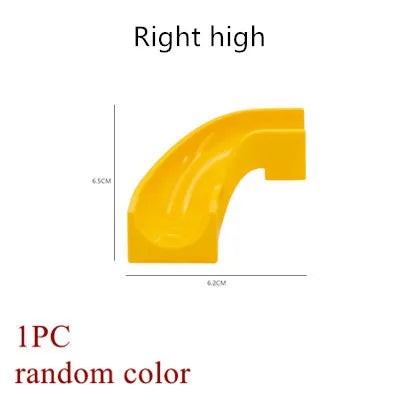 A yellow marble run building block piece shaped like a right high curve.