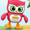 A red owl toy with large green eyes and yellow feet, designed for musical dance and light features.