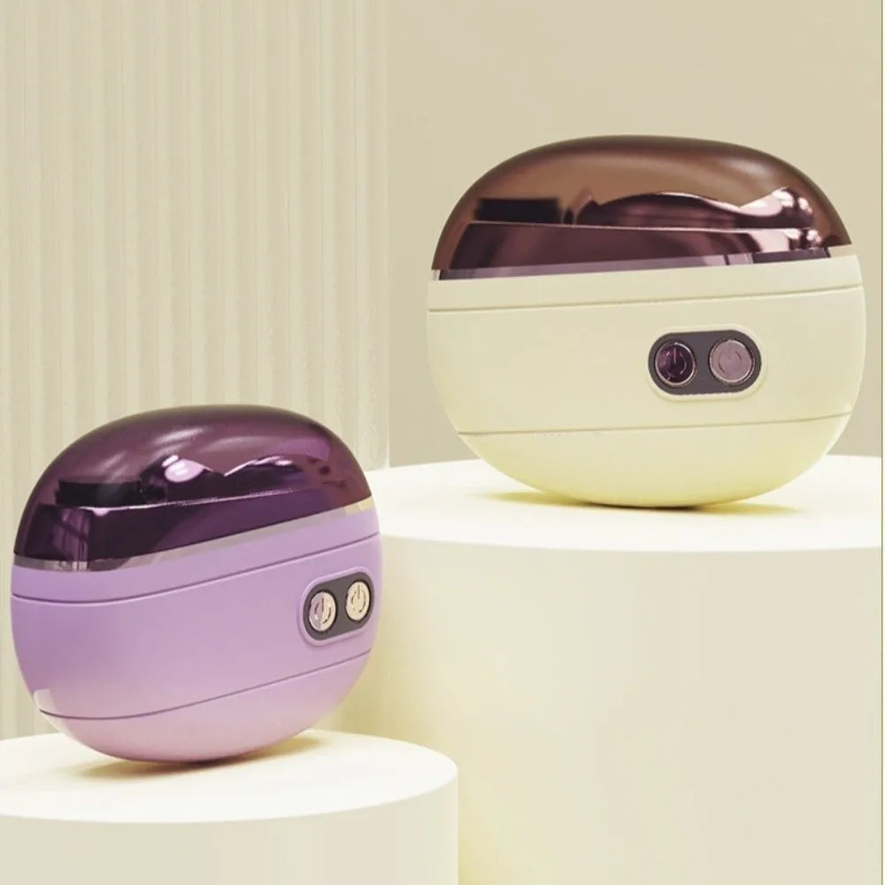 A pair of purple and beige rechargeable electric nail clippers and grinders displayed on white pedestals.