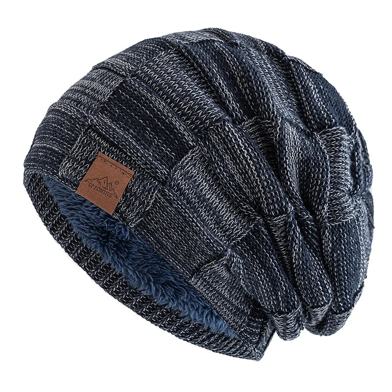 A dark gray and black knit beanie with a textured, slouchy pattern.