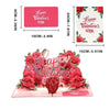 A pink 3D pop-up Valentine's Day card featuring a red rose tree design with a couple silhouette.