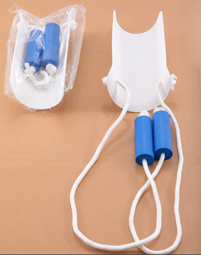 A white plastic mold for applying blue socks, with a string attached to the socks.