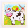 A wooden jigsaw puzzle featuring a white cow with pink features and a yellow chick in a green field.