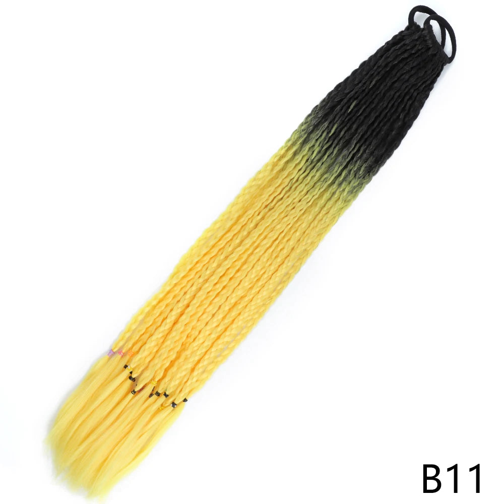 A pre-braided ponytail extension featuring a gradient color transition from yellow to black.