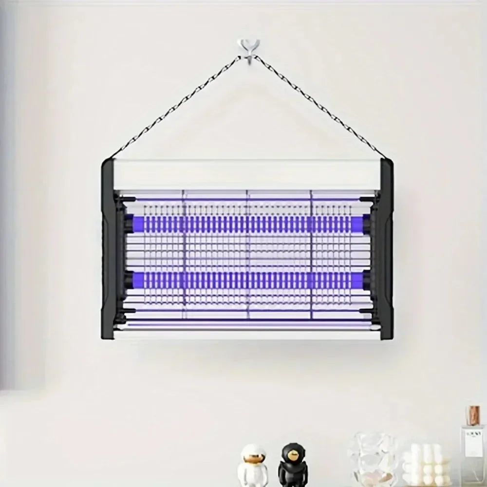 A black electric mosquito killer lamp with a UV light trap suspended by a wire against a white wall.