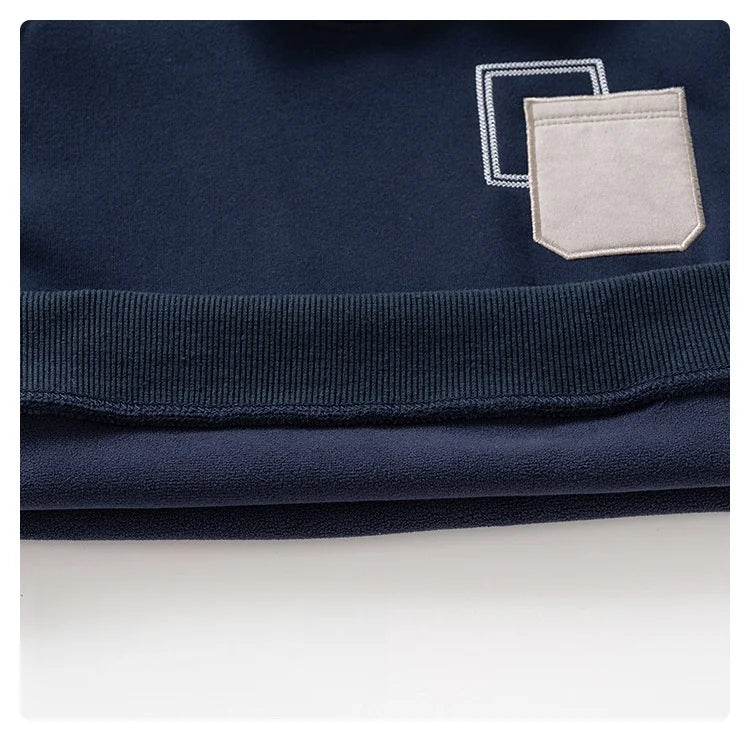 Navy blue fleece pullover sweatshirt with a light gray pocket detail and ribbed collar.