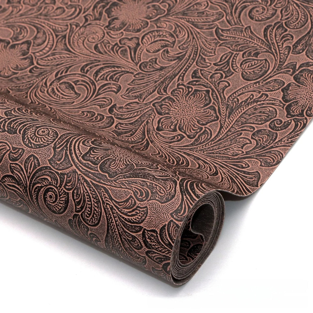 Roll of vintage floral textured faux leather fabric in brown tones
