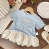 Light blue girls cotton short sleeve tee with a lace hem and a small embroidered tag displayed on a wooden hanger.