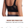 A woman wearing a black sports bra with mesh back and elastic on the wing, designed to prevent back flush.