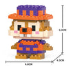 A micro building block figurine of a bear wearing a purple and orange hat and blue clothing.
