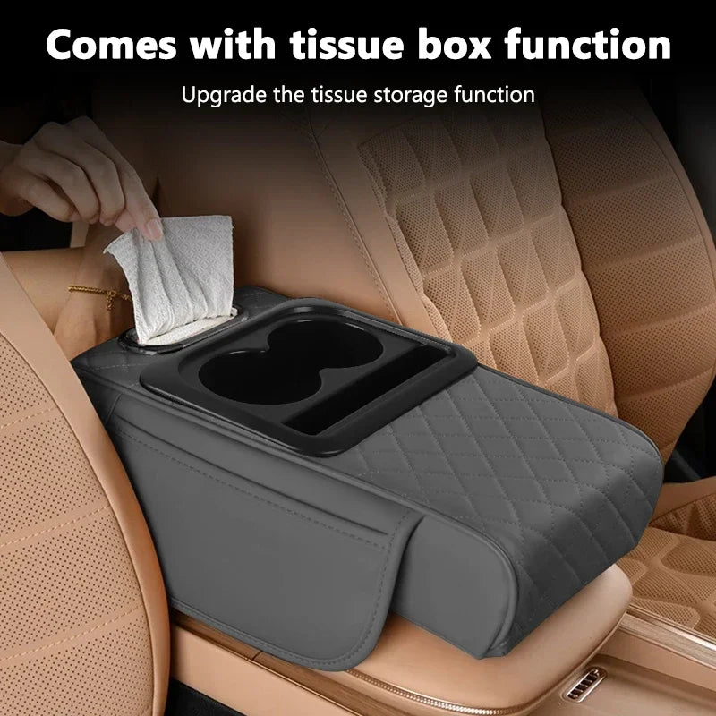 A gray car center console organizer with an armrest cushion and tissue box function is shown in a vehicle interior.