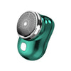 A close-up view of a teal electric shaver with a silver mesh head and a black body.