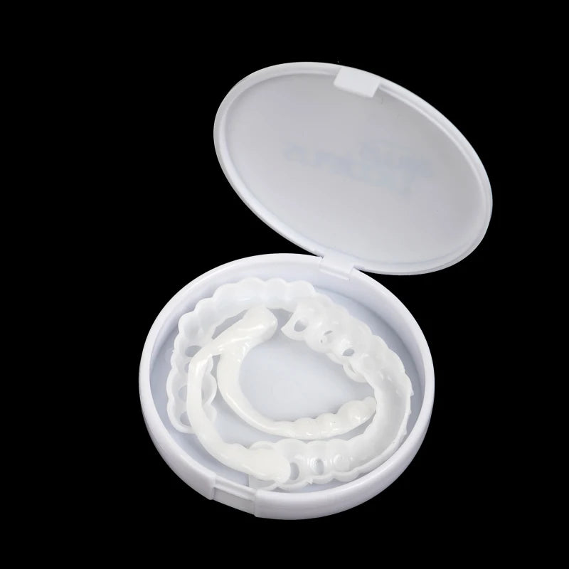 A white cosmetic denture teeth kit is displayed in an open white case.