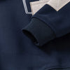 Navy fleece pullover sweatshirt with a denim collar detail and light beige cuff.
