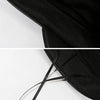 Close-up view of a black PU leather beret hat with adjustable black laces.