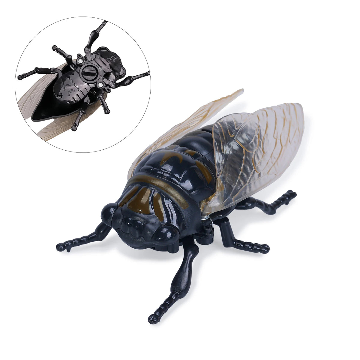 A detailed wind-up model of a dark insect, resembling a ladybug or bee, shown alongside a smaller version.