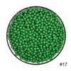 A circular arrangement of small, bright green water beads.