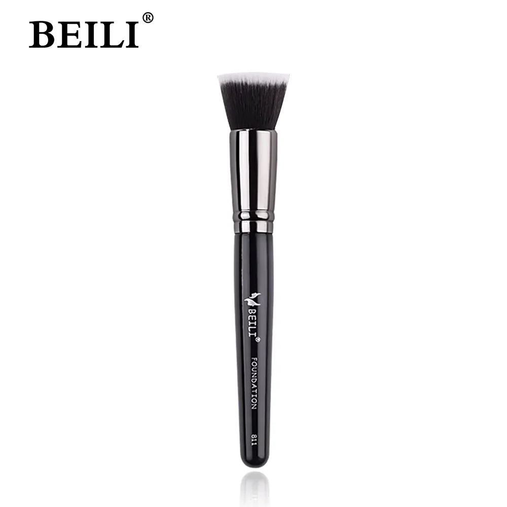 A black professional makeup brush for applying foundation, concealer, and blush.