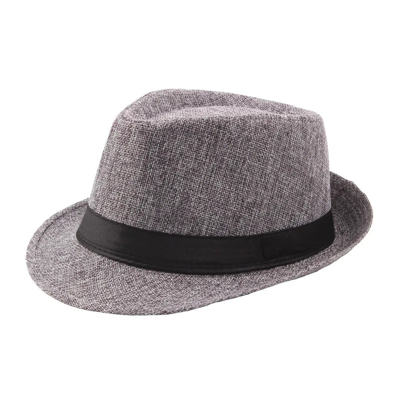 A gray woven straw fedora hat with a black band shown from above.