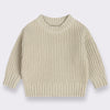 A beige knitted long-sleeve pullover sweater for kids.