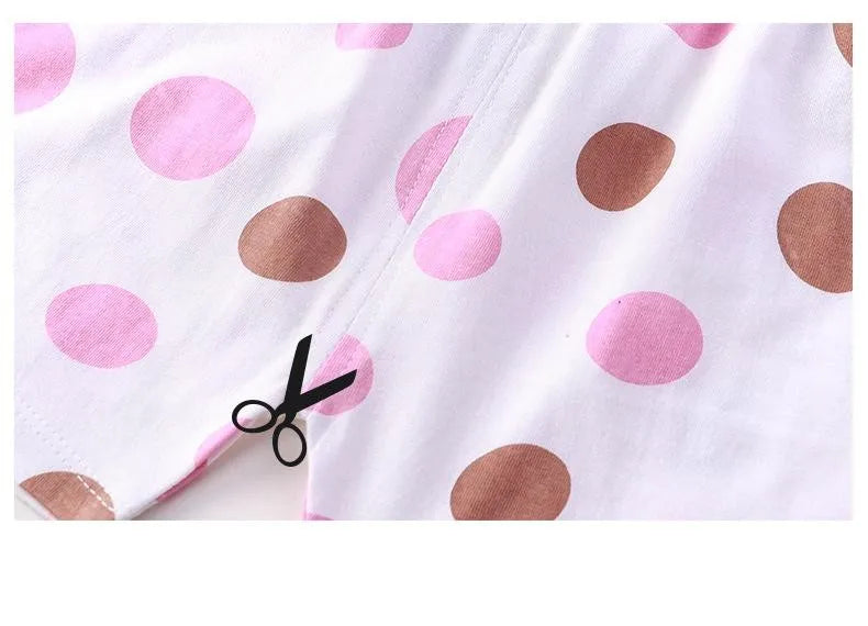 White children's short-sleeve shirt and shorts set with pink and brown polka dots